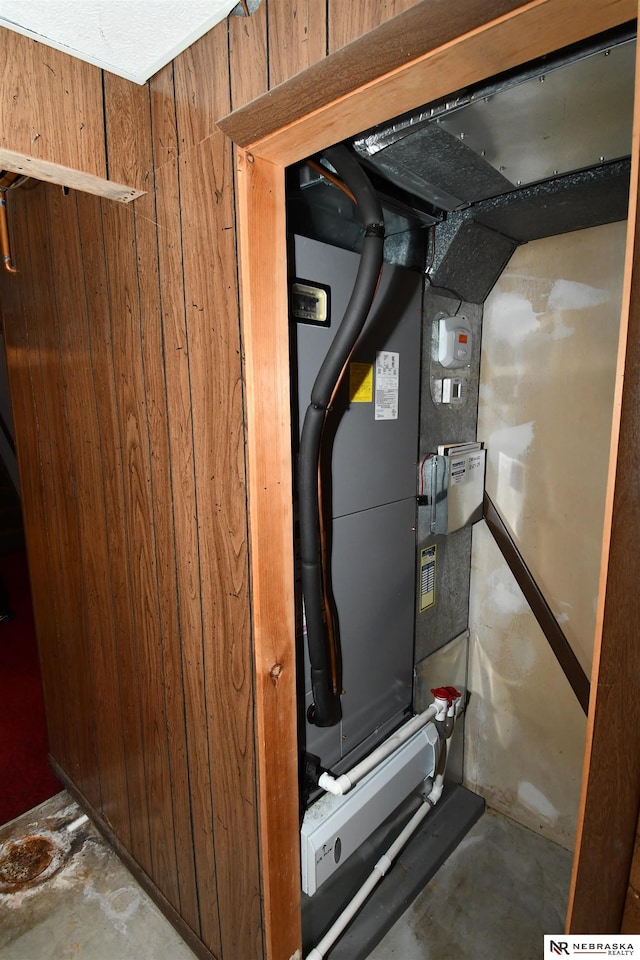 utility room featuring heating unit