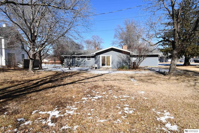 view of front of home featuring a chimney