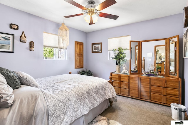 bedroom with light colored carpet and ceiling fan