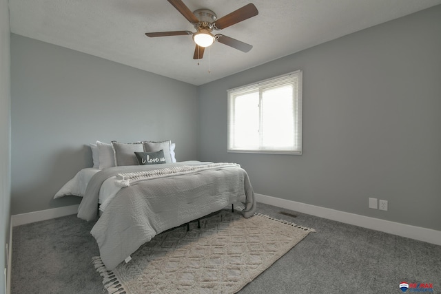 bedroom featuring carpet, visible vents, ceiling fan, and baseboards