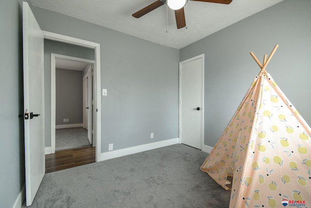 unfurnished bedroom with carpet flooring, ceiling fan, and baseboards