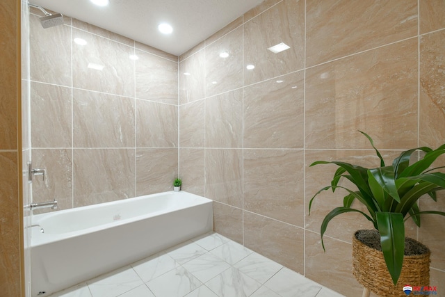 full bath with marble finish floor, shower / bathing tub combination, tile walls, and recessed lighting