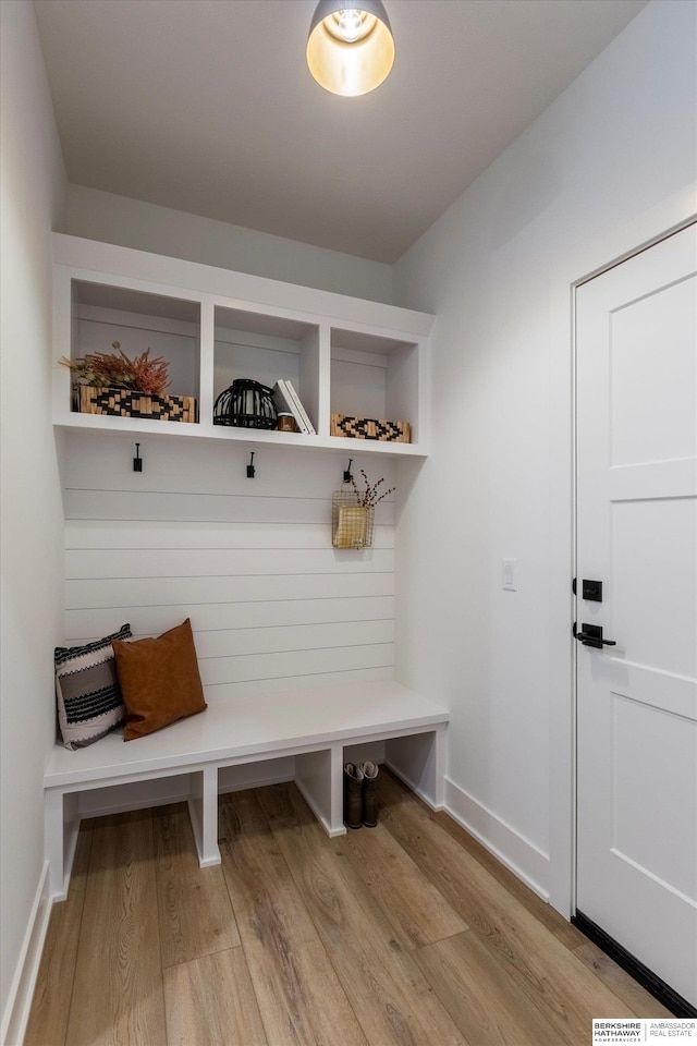 mudroom with light wood-type flooring and baseboards