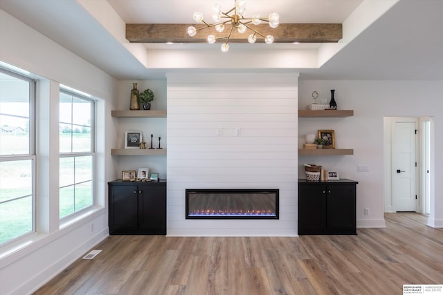 bar with baseboards, visible vents, light wood-style flooring, beamed ceiling, and a fireplace