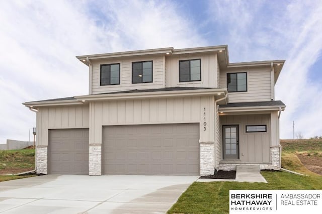 view of front facade featuring a garage, stone siding, and driveway