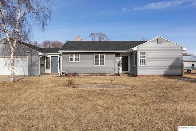 ranch-style house featuring entry steps, a garage, a shingled roof, a chimney, and a front yard