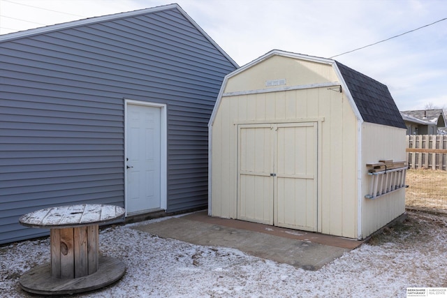 view of shed with fence