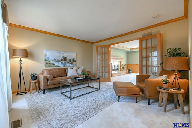 living room featuring french doors, visible vents, and ornamental molding