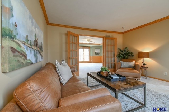 living room with visible vents, ornamental molding, french doors, carpet floors, and baseboards