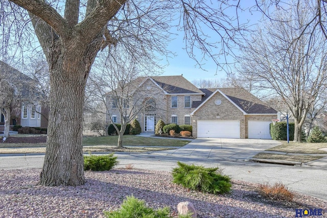 view of front facade with brick siding, concrete driveway, and an attached garage