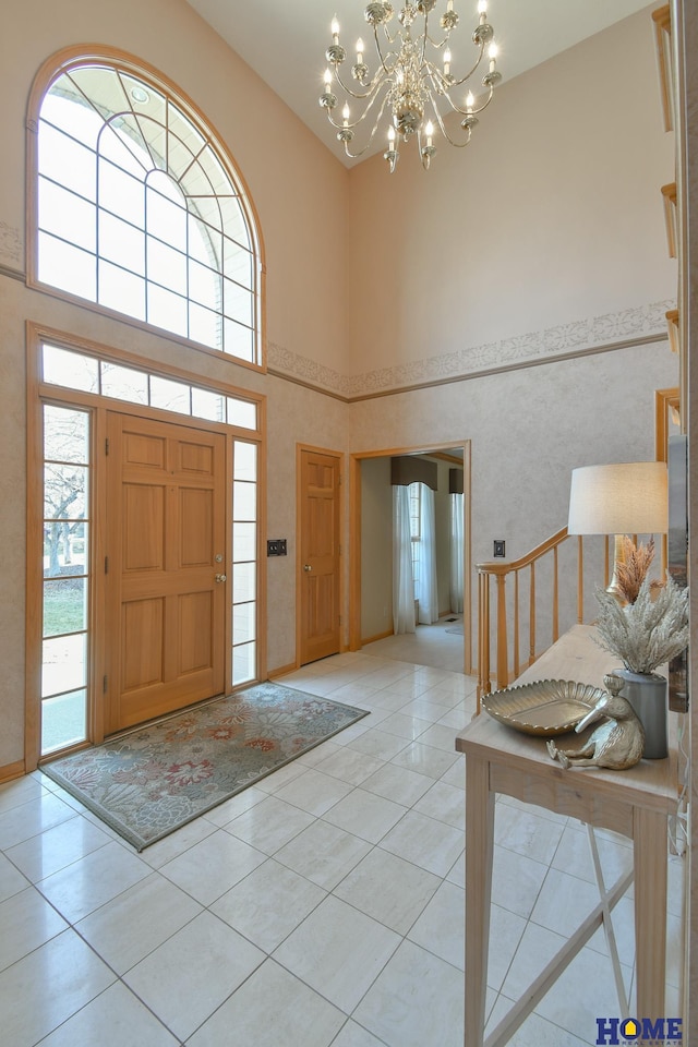 foyer with light tile patterned flooring and a healthy amount of sunlight