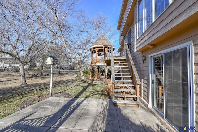 view of patio / terrace featuring stairway