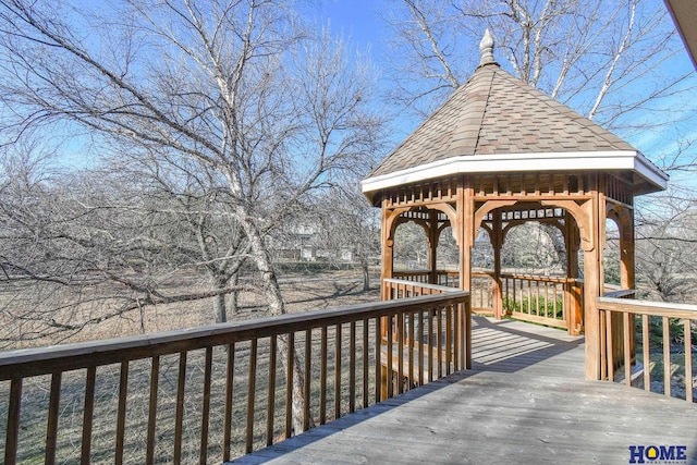 wooden deck featuring a gazebo