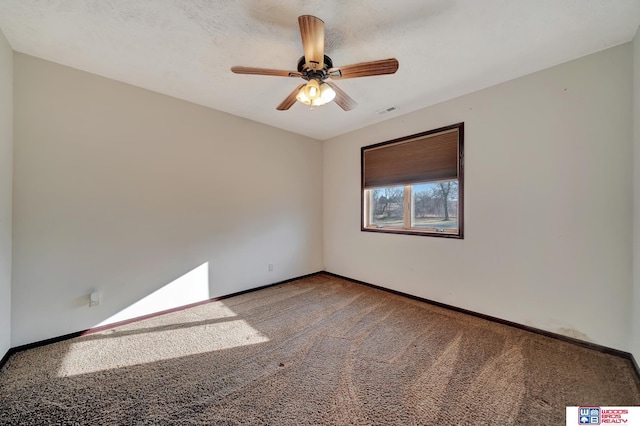 unfurnished room featuring visible vents, baseboards, ceiling fan, and carpet flooring