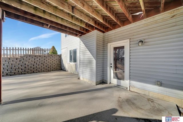 view of patio / terrace featuring fence