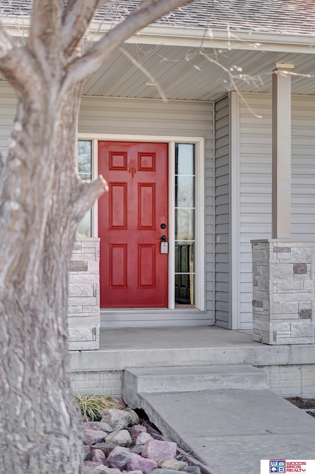 property entrance with covered porch