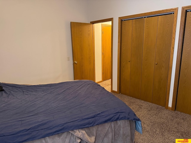 bedroom featuring light colored carpet