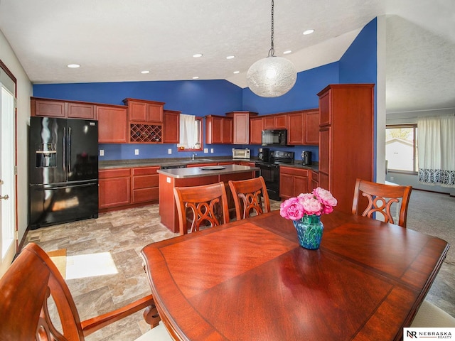 dining space featuring high vaulted ceiling