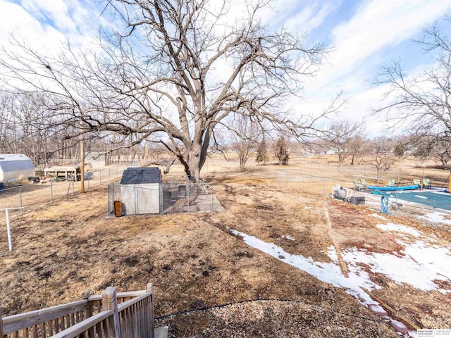 view of yard with an outbuilding and a rural view