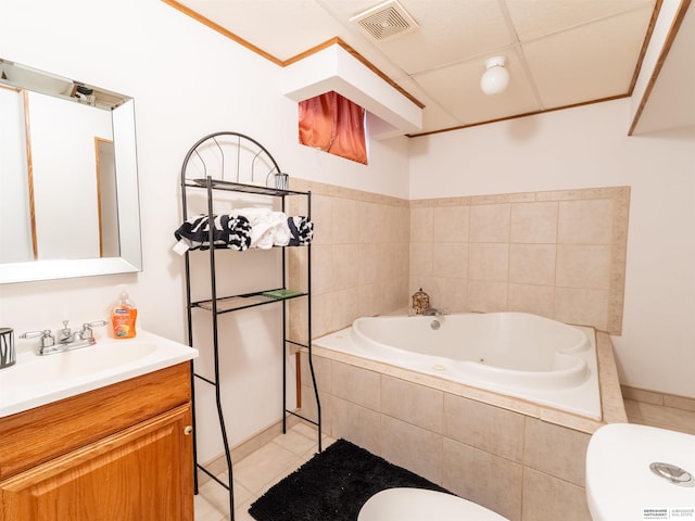 bathroom featuring visible vents, toilet, vanity, tile patterned flooring, and a jetted tub