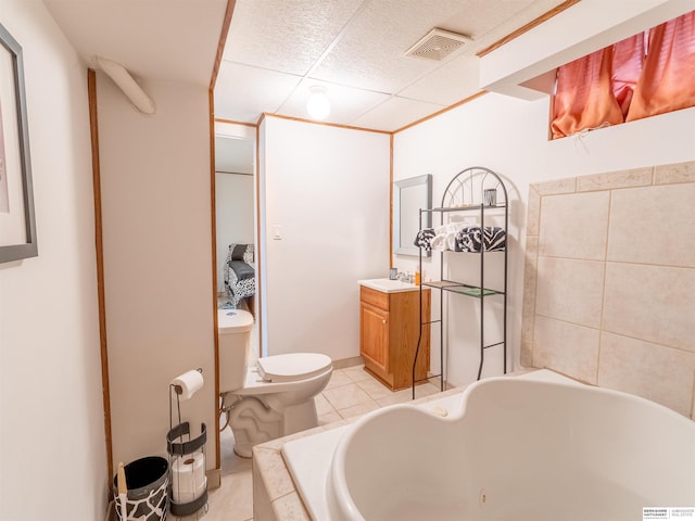 full bathroom with a tub to relax in, toilet, vanity, visible vents, and tile patterned floors