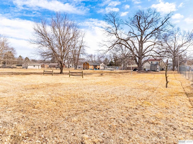 view of yard with a residential view and fence