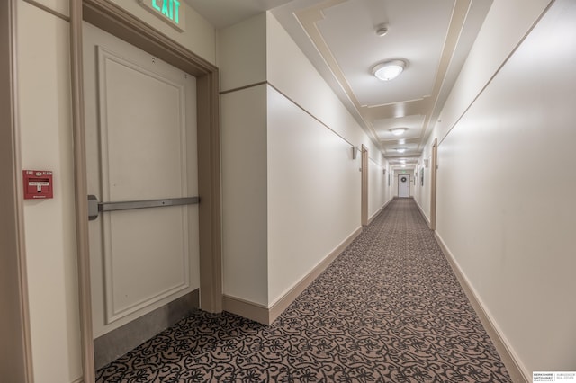 corridor featuring baseboards