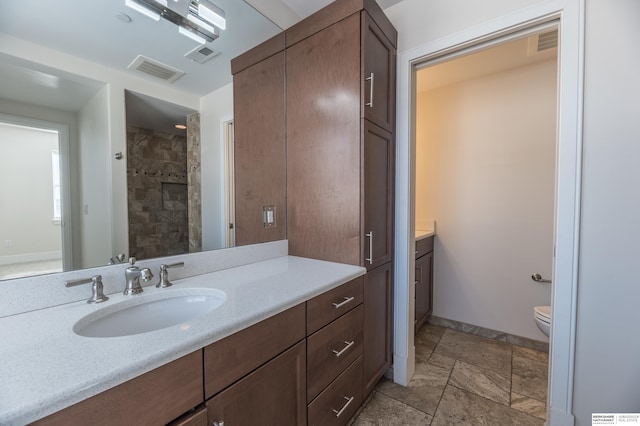 full bath with toilet, visible vents, and vanity