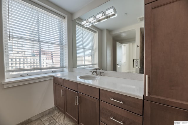 bathroom featuring visible vents and vanity