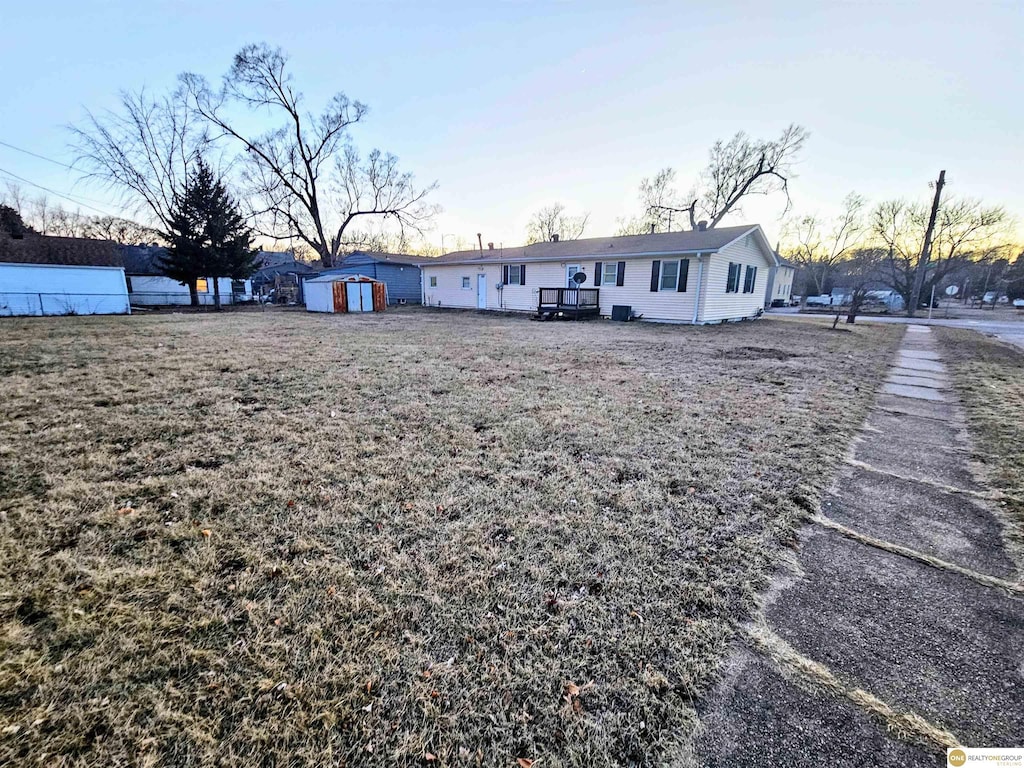 exterior space featuring a shed, an outdoor structure, and fence