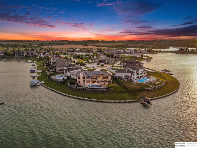 drone / aerial view with a water view and a residential view