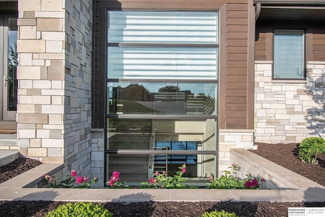 exterior details featuring brick siding