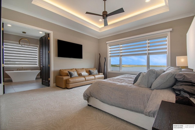 bedroom with ceiling fan, a tray ceiling, crown molding, and recessed lighting