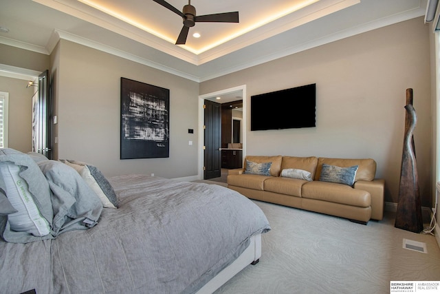 bedroom featuring visible vents, a raised ceiling, baseboards, ceiling fan, and ornamental molding