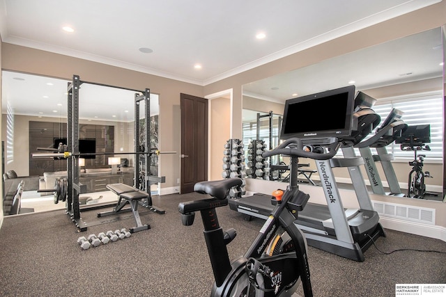 workout area featuring baseboards, ornamental molding, and recessed lighting