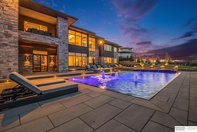 outdoor pool featuring a patio area