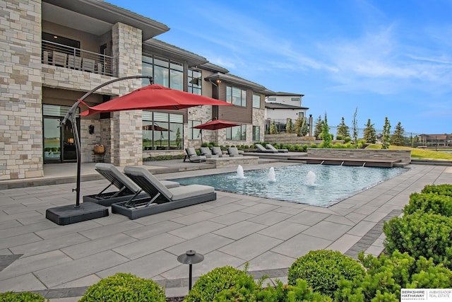 outdoor pool with a patio