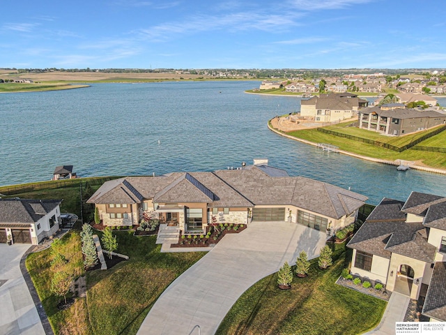 birds eye view of property with a residential view and a water view