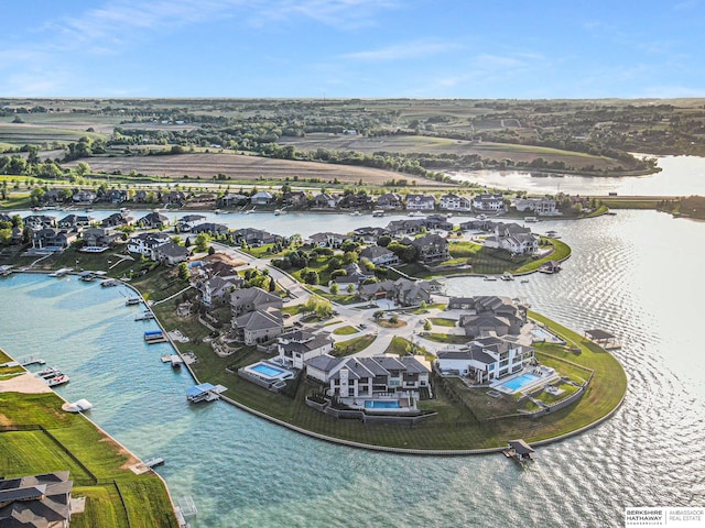 birds eye view of property with a residential view and a water view