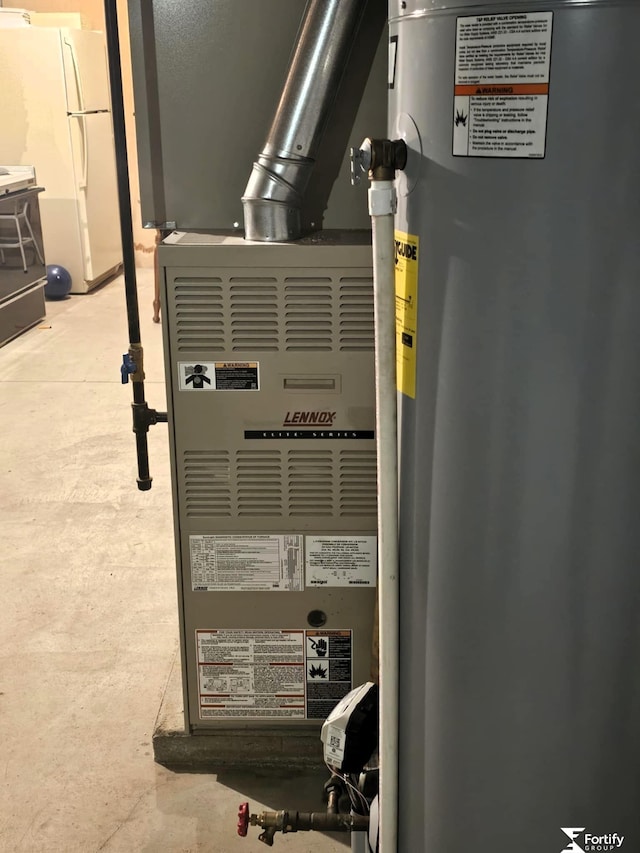 504 N Plum St, Shickley, NE 68436 - utility room with water heater and heating unit