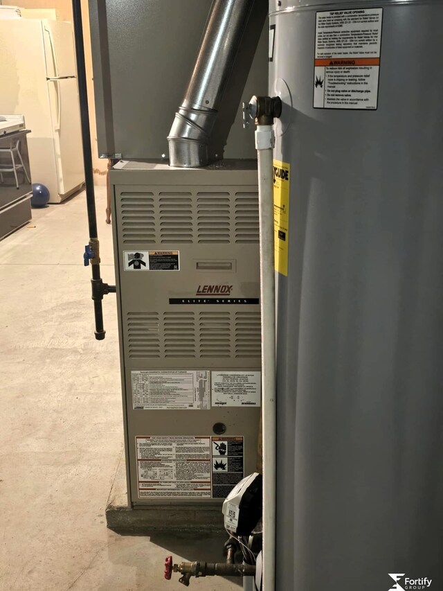 504 N Plum St, Shickley, NE 68436 - utility room with water heater and heating unit
