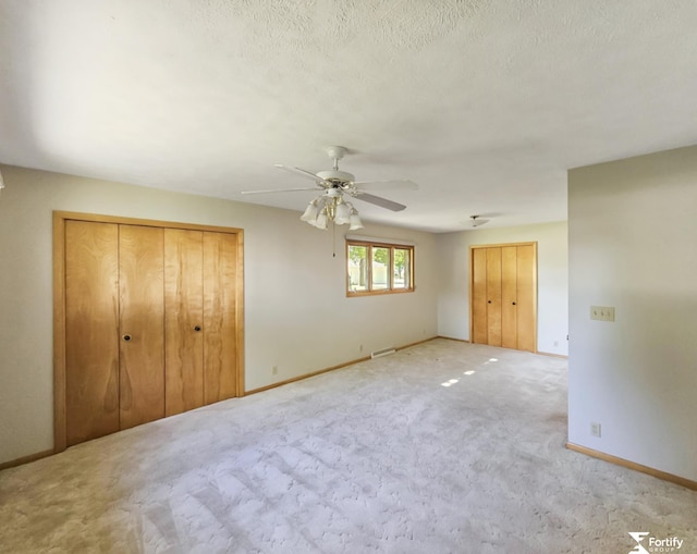 504 N Plum St, Shickley, NE 68436 - unfurnished bedroom featuring carpet, baseboards, and ceiling fan