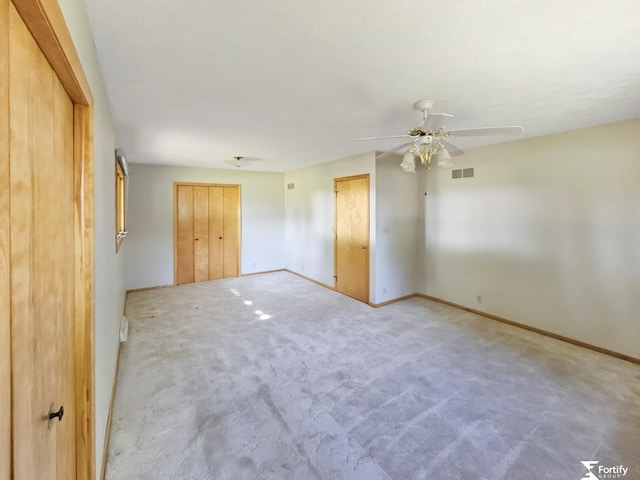 504 N Plum St, Shickley, NE 68436 - empty room with a ceiling fan, baseboards, and carpet flooring