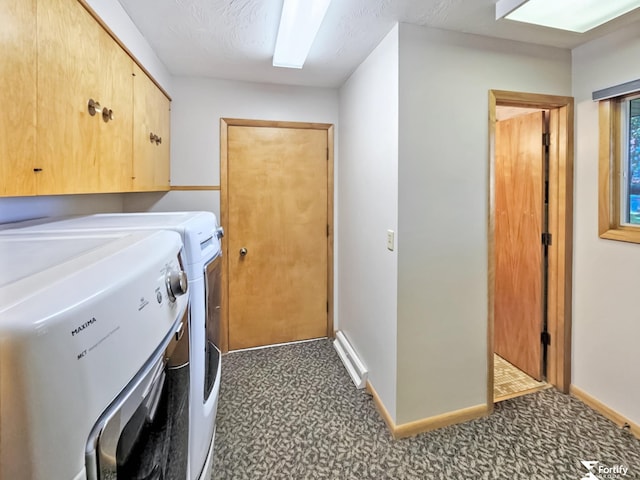 504 N Plum St, Shickley, NE 68436 - clothes washing area featuring washing machine and dryer, cabinet space, and baseboards