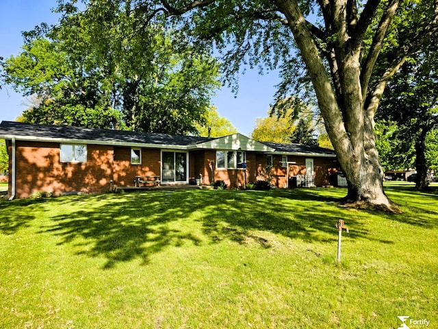 504 N Plum St, Shickley, NE 68436 - view of front of house featuring a front lawn and brick siding