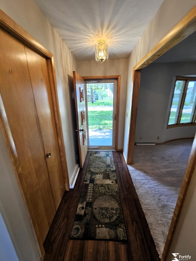 504 N Plum St, Shickley, NE 68436 - doorway with plenty of natural light, a baseboard radiator, a chandelier, and baseboards