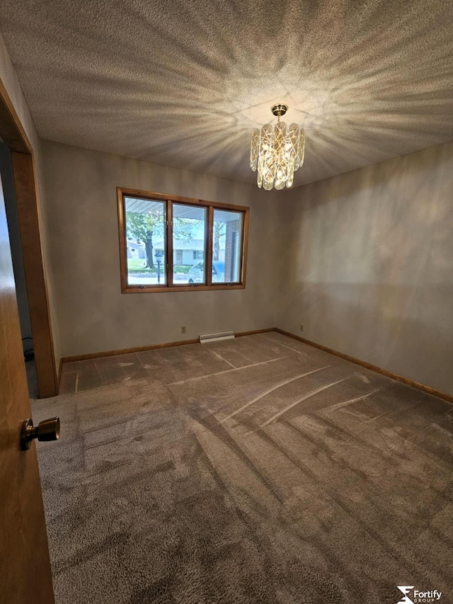 504 N Plum St, Shickley, NE 68436 - unfurnished room with carpet floors, a chandelier, baseboards, and a textured ceiling