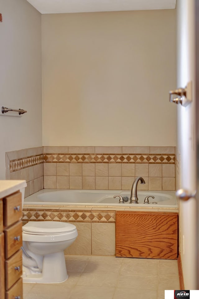 full bathroom with a bathtub, tile patterned flooring, vanity, and toilet