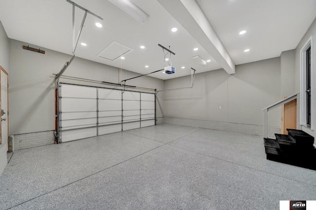 garage featuring recessed lighting and a garage door opener