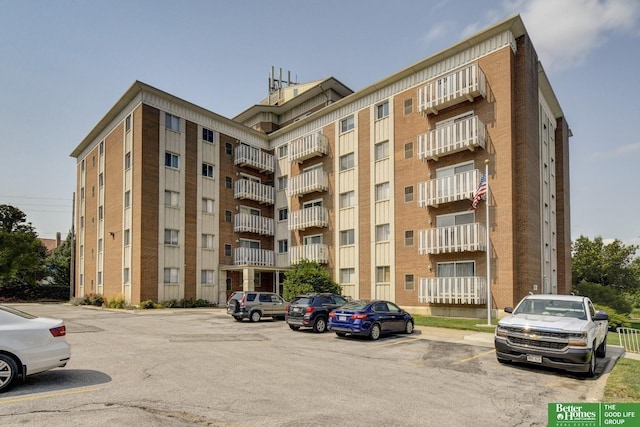 view of property with uncovered parking